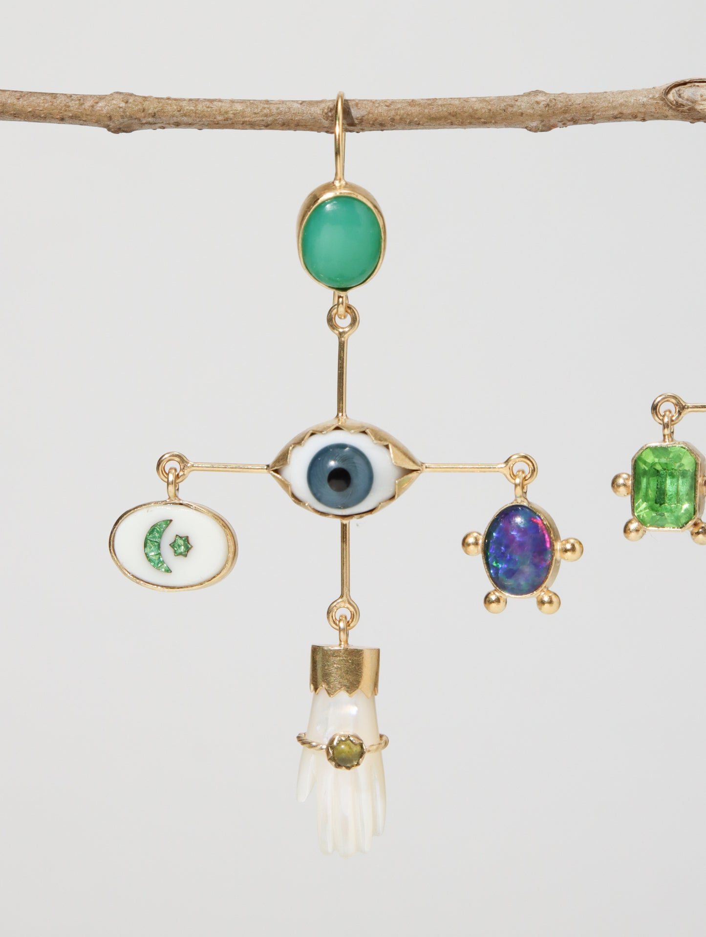 EYE CROSS ドロップピアス White and Green